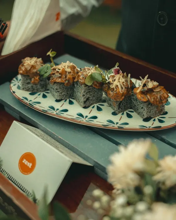 Artfully plated sushi appetizers on a decorative platter, showcasing our attention to presentation.