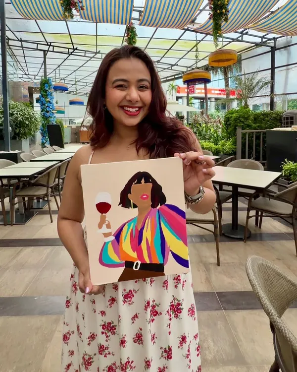 The birthday girl, Nicole Concessao, with her vibrant finished painting. Hosting her paint party was a truly special experience filled with warmth and creativity.