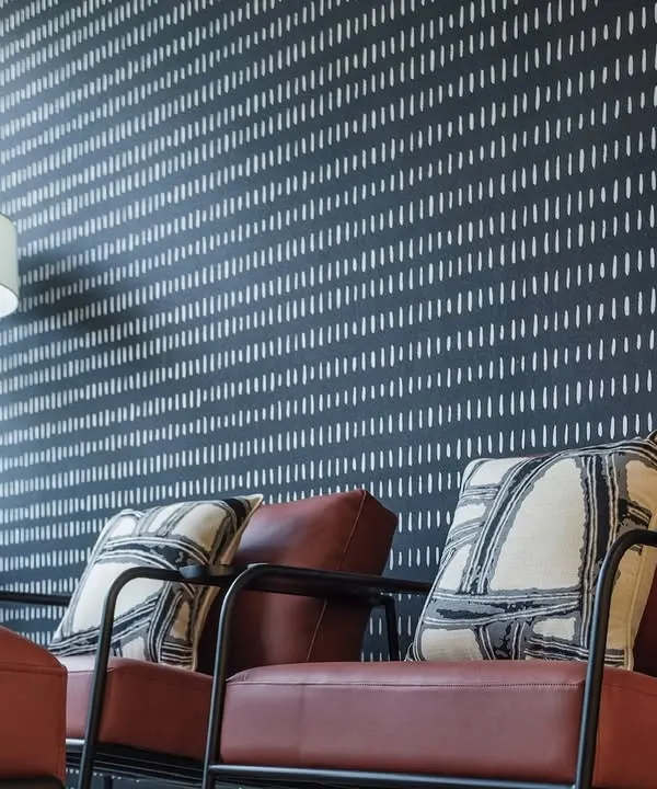 For a law office, I designed this smart and clean wallpaper with a pattern resembling a modern ikat or stitch mark. The dark color and repeating lines create a sophisticated, contemporary look.