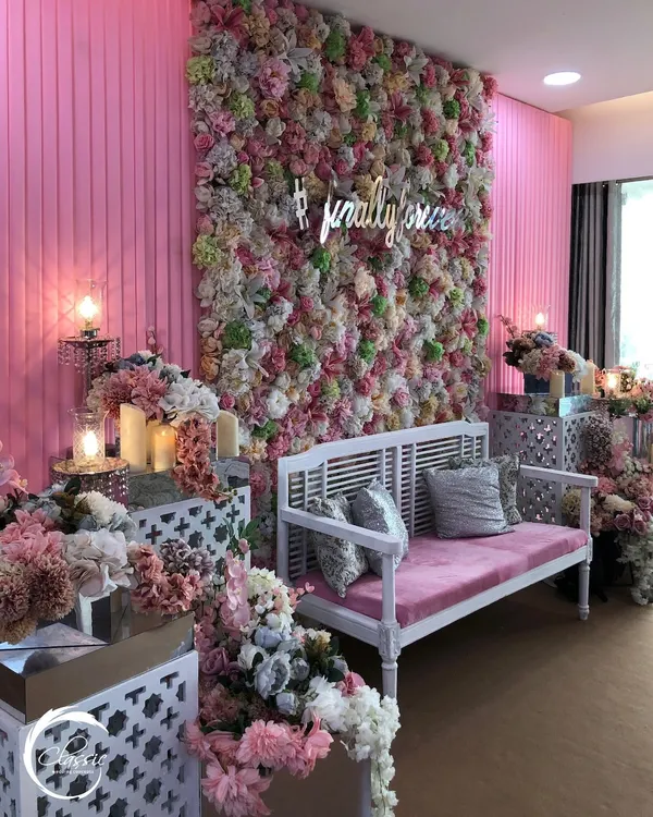 This indoor Mehendi was a pastel dream. I designed a floor-to-ceiling flower wall with a custom '#finally' neon sign, paired with elegant white and pink seating for a chic and modern look.