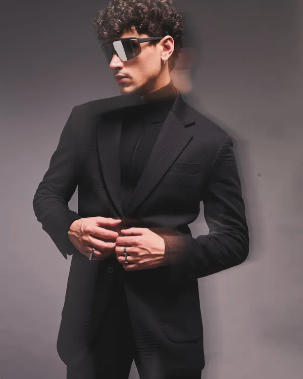 A lesson in monochromatic dressing for a menswear campaign. I styled this all-black look with a long coat, turtleneck, and futuristic sunglasses, using motion blur to add a dynamic and edgy feel to the sartorial look.