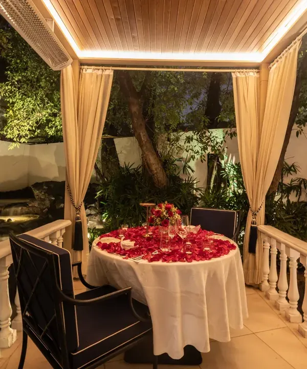 This is the heart of Sevilla, a private cabana set for a perfect romantic evening. We believe in creating moments that you will cherish, with soft candlelight, fragrant rose petals, and an atmosphere of pure magic.