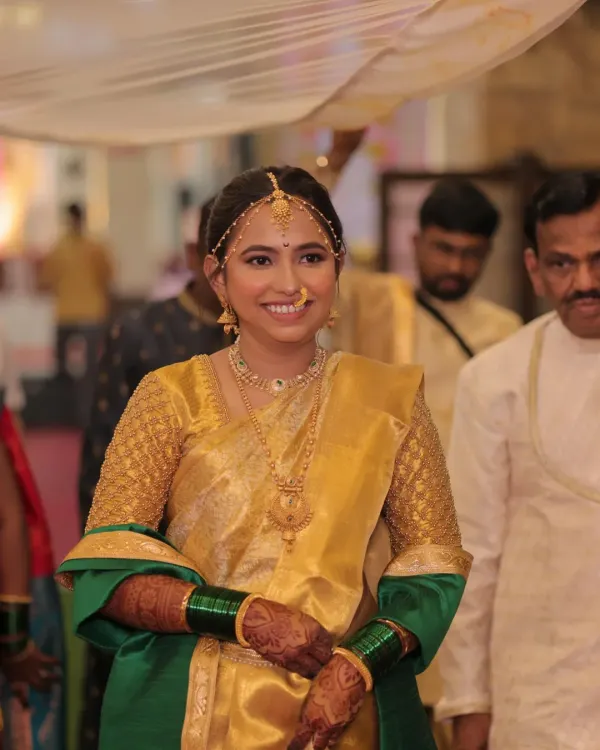 My beautiful Maharashtrian bride Dhanashree, ready for her wedding ceremony. Her golden silk saree with a green shela is a classic and elegant choice.