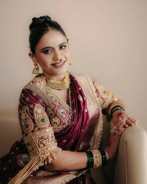 A tribute to the timeless beauty of the Maharashtrian bride. We curated a look that was bold yet soft, radiant yet rooted, bringing out her inner Maharani in a stunning Nauwari saree.
