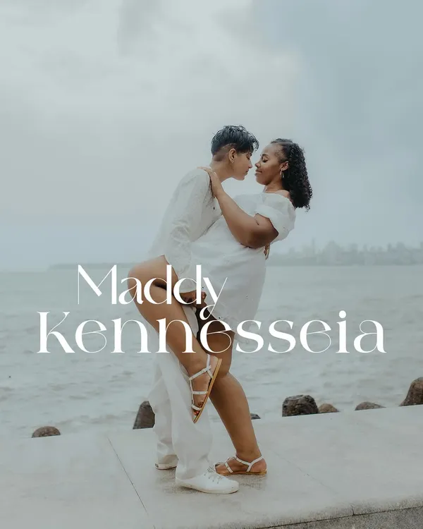 A beautiful, romantic lift against the backdrop of the sea. This image celebrates the couple's love and connection in a powerful and joyful way.