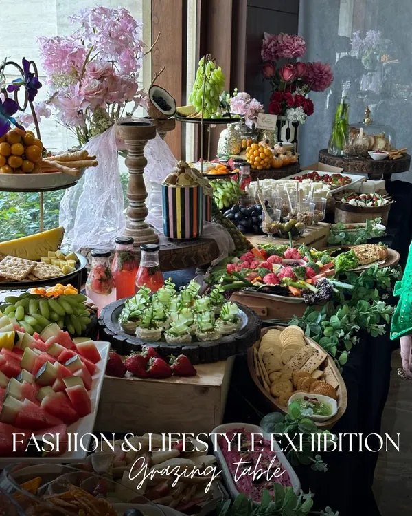 For a fashion and lifestyle exhibition, we created a grazing table that was as stylish as the event itself. The spread included fresh fruits, artisanal cheeses, and elegant canapés, all interwoven with lush greenery and floral arrangements.