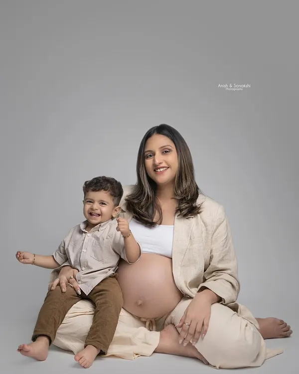 A heartwarming maternity shoot photo with mother and son. I created a very subtle, 'no makeup' makeup look to give the mother to be a natural and radiant glow.