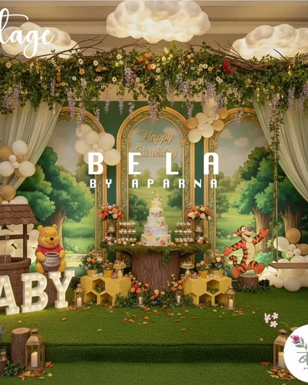 This is the main stage for a Winnie the Pooh party, designed to look like a scene from the Hundred Acre Wood. It features a custom-painted backdrop, character cutouts, a wishing well prop, and illuminated 'BABY' letters for a first birthday.