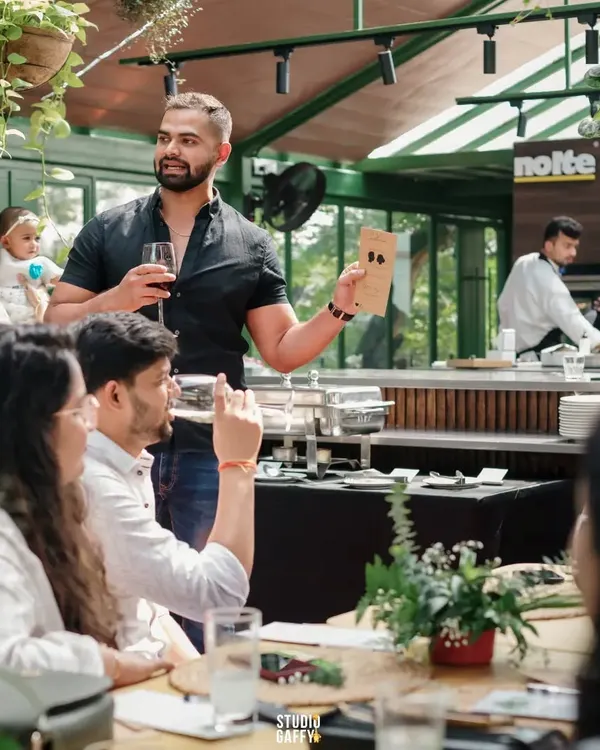 Performing close-up magic in a more intimate setting. This format is perfect for private parties or breaking the ice at networking events, as I engage with small groups directly at their tables.