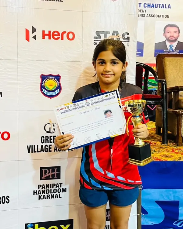 Prisha Agarwal with her Bronze medal and certificate from the Haryana State Ranking Table Tennis Championship. Her consistent performance at the state level is a result of her discipline and commitment to our advanced youth training.