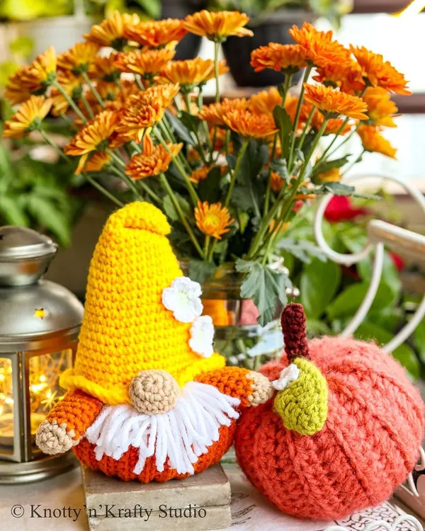 My roly-poly Pumpkin Gnome posing with a cheerful orange pumpkin. He's the perfect little friend to bring out when autumn arrives.