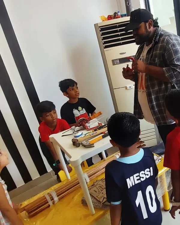 An instructor introduces a group of young learners to basic woodworking tools. We start with the fundamentals of tool handling and safety before any building begins.
