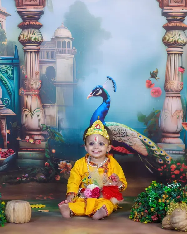 This is one of my favorite themes, the Little Krishna shoot. I love creating these vibrant, divine setups for Janmashtami, complete with a beautiful peacock backdrop, traditional props like the matki, and a custom-made crown for your little one.