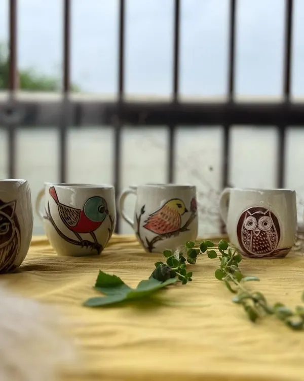 This lineup of mugs includes a special one with a dog portrait. I love capturing the sweet faces of pets in my work.