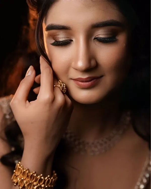 A soft and dreamy look perfect for an engagement or pre-wedding photoshoot. The makeup focuses on a natural glow, with soft waves in the hair.