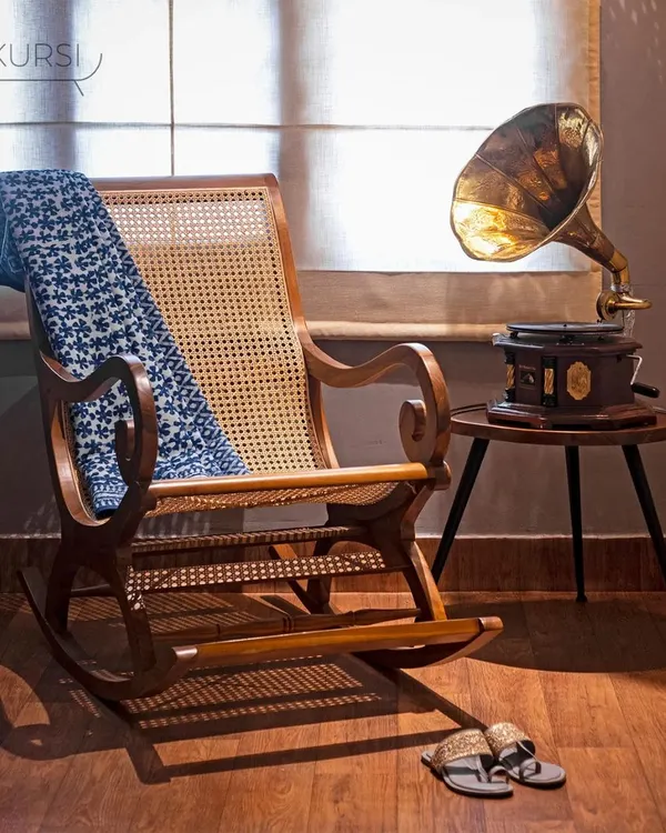 This is where timeless design meets pure relaxation. My handcrafted 'Toshi' rocking chair, made from solid teak with a handwoven rattan seat and back, is more than a piece of furniture; it's an invitation to slow down. I designed it to be a vintage classic for the modern home.