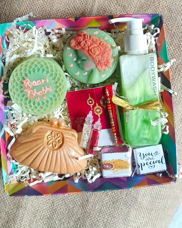 This "Pyari Bhabhi" Rakshabandhan hamper is one of my favorites. It includes a personalized soap, a purse-shaped soap, aloe vera body wash, and a beautiful Lumba rakhi, all curated to make your sister-in-law feel truly special.