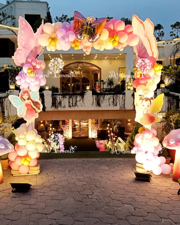 I design breathtaking entrances that transport your guests into a world of wonder from the very first step. This outdoor fairy and butterfly arch, complete with glowing 3D mushrooms and intricate balloon work, set a magical tone for a first birthday celebration.