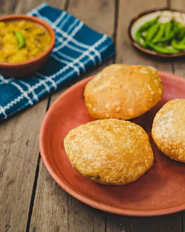 Our famous Khasta Kachori served with classic Aloo Sabzi. This is the ultimate comfort food, crispy on the outside and packed with a flavourful dal filling.