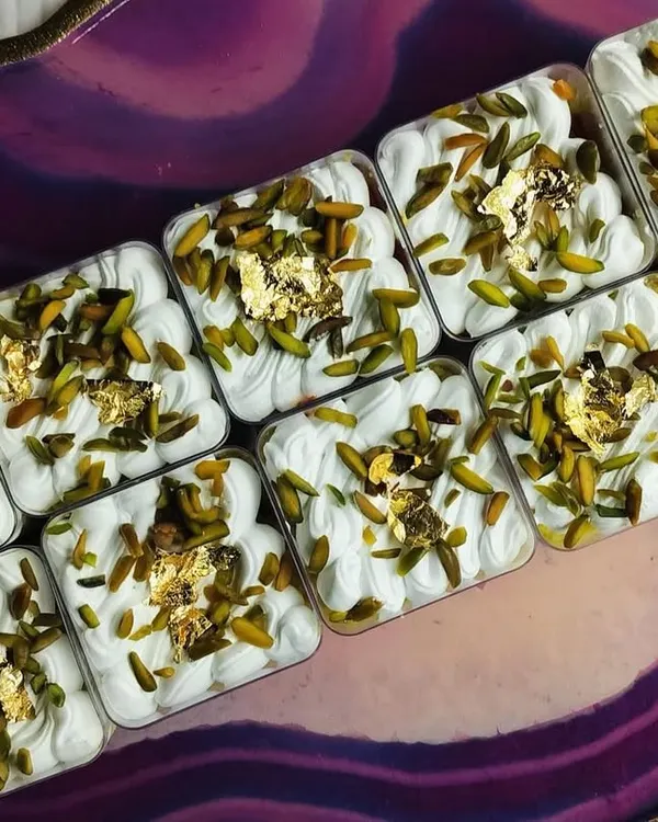 These are my Kesar Pista Tres Leches Cups, made specially for Rakhi. Each cup has a moist, saffron-infused sponge soaked in rich milk and topped with pistachios and edible gold leaf.