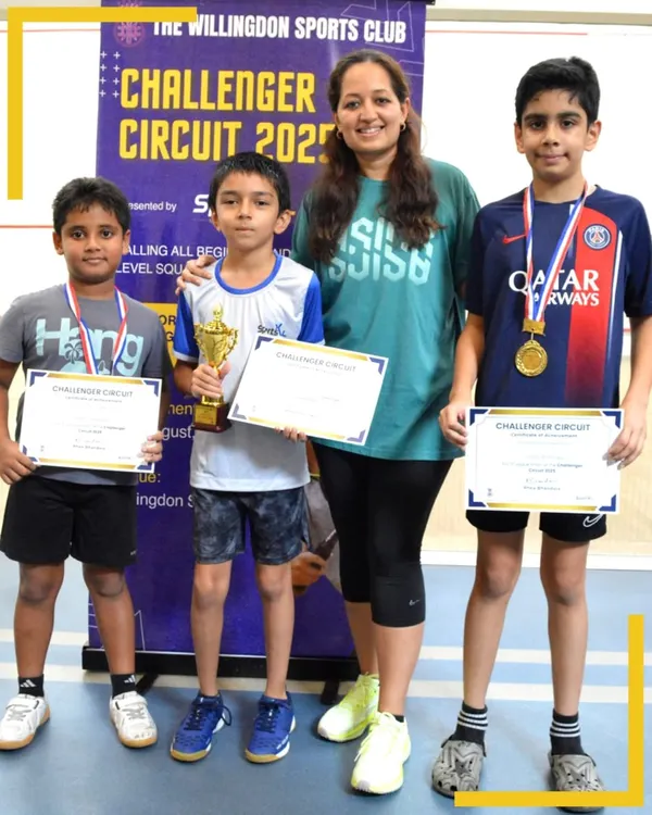 Celebrating the winners of the Challenger Circuit 2025. These young boys showcase the bright future of squash, holding their trophies and certificates with pride.