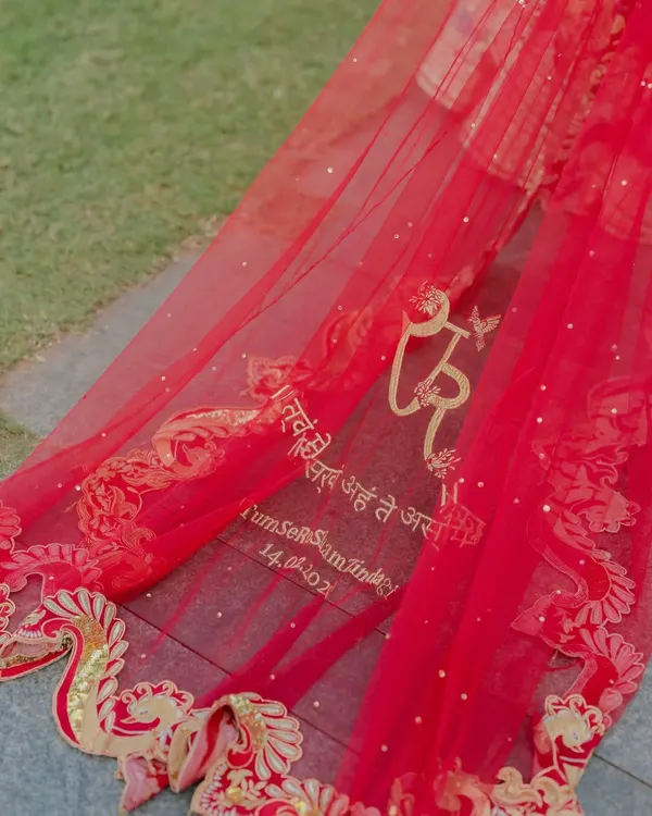 Your story is in the details. For this bride, I helped design a personalized veil embroidered with a meaningful Sanskrit verse and their wedding date, a bespoke touch that weaves their personal saga directly into the fabric of their day.