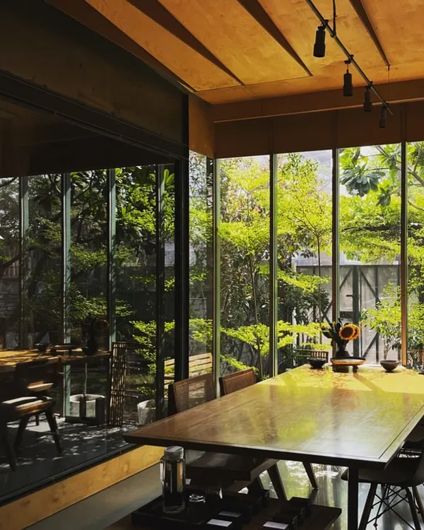 The morning sun filtering through the trees and into our studio meeting area. This connection to nature and the changing light is the essence of the space we've created for ourselves and our work.