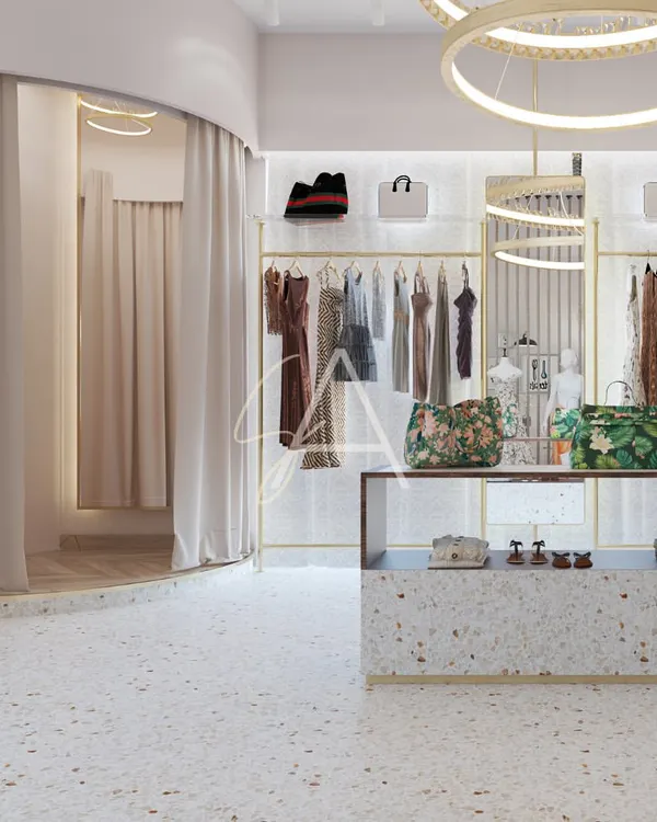 A wide view of the 'Beige Bag' boutique, showing the central display counter and elegant ring chandeliers. We used terrazzo flooring and backlit clothing racks to create a bright, inviting, and high-end retail experience.
