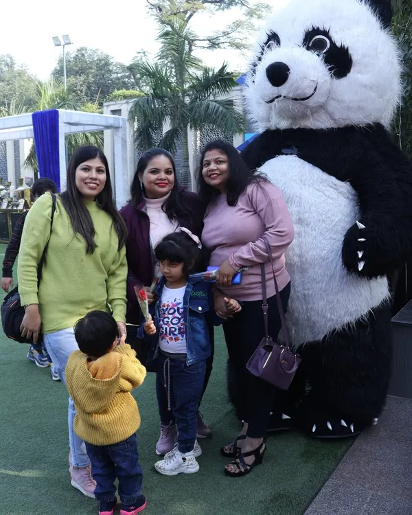 Our panda mascot is a crowd favorite, seen here posing with a family at an outdoor event. These gentle giants are perfect for meet and greets.