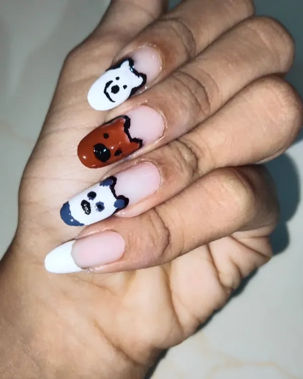 If you have a favorite cartoon, I can paint it. This client wanted a 'We Bare Bears' theme, so I hand-painted Ice Bear, Grizz, and Panda on different nails. This is a fun example of custom character art on gel extensions with a French tip base.