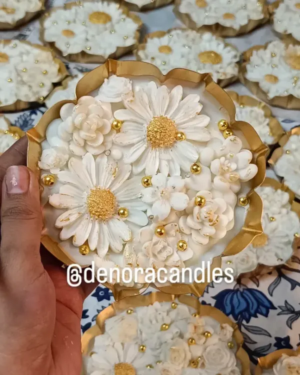 A close-up look at the hand-finished details of my white and gold floral urli candle. Each petal and pearl is carefully placed to create a stunning, intricate design.