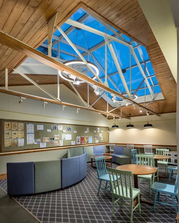 By introducing a large skylight and removing partitions, we turned a cramped attic into an expansive, light-filled learning space. This project at Woodstock School shows how bold interventions can respect a building's history while adapting it for 21st-century needs.