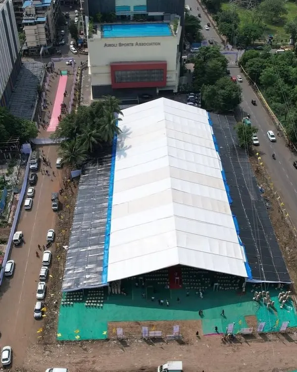 An aerial shot of the massive waterproof tent I set up for the Koli Bhavan Bhumi Pujan in Airoli. This demonstrates my capacity to handle infrastructure for events with thousands of attendees.