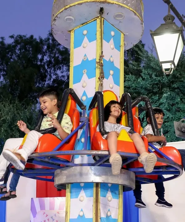 Pure joy on the spinning ride! I provide a variety of kid-friendly amusement rides that are always a highlight of any carnival or large-scale community event.