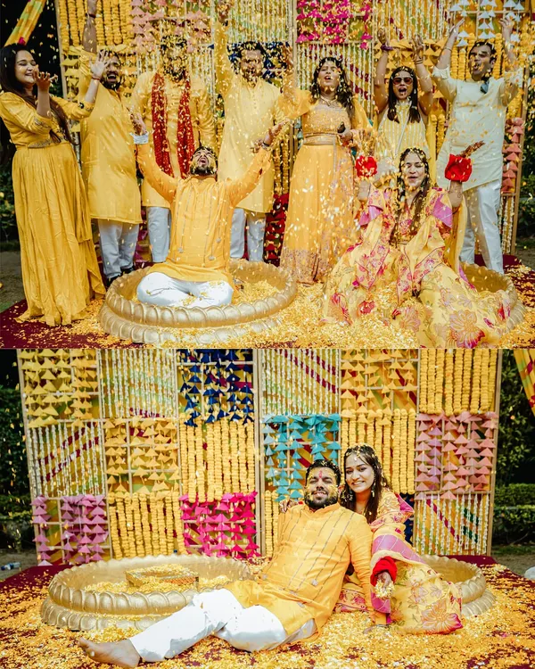 Pure Haldi happiness. I love capturing the peak moments of celebration, like this one where the groom is showered with flower petals by his entire family and friends.
