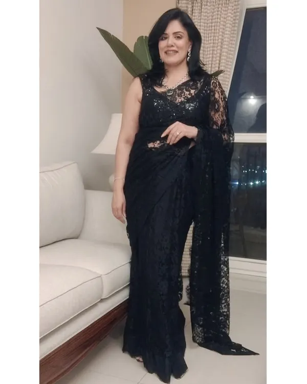 Here is a full-length view of the black Chantilly lace saree I wore for a milestone birthday party. The delicate lace and sequin blouse create a look of timeless elegance, perfect for a formal evening celebration.