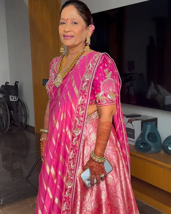 Elegant, sophisticated, and forever beautiful. This look for the mother of the bride focuses on enhancing her natural grace with soft, flattering makeup that complements her stunning pink outfit.