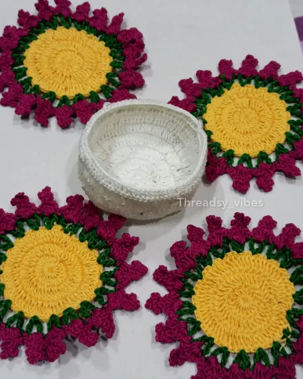 A complete set of my floral crochet coasters. This set of four comes with a matching white crocheted holder to keep them neatly stacked when not in use. They are perfect for protecting your table in style.