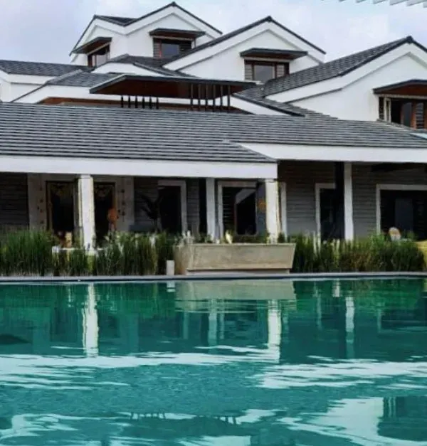 Reflections of sophistication. This large residence with classic influences is perfectly mirrored in the still water of the swimming pool, creating a stunning visual dialogue between the home and its landscape.