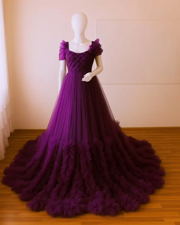 A full view of my popular magenta ruffled gown on a mannequin. This allows you to see the quilted bodice, floral shoulder detail, and the voluminous tiered train.