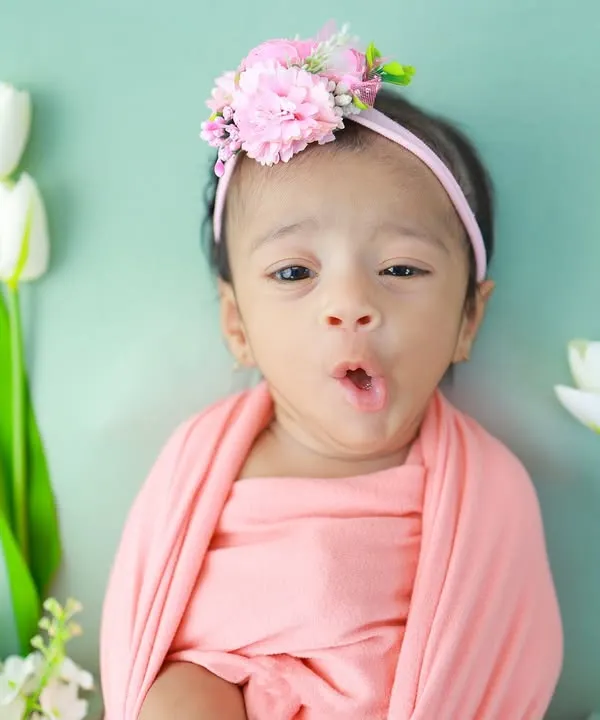 Look at this little expression queen. While sleeping poses are beautiful, I also adore capturing these awake moments filled with personality. This little 'o' of surprise is a perfect example of the candid, fleeting expressions I watch for.