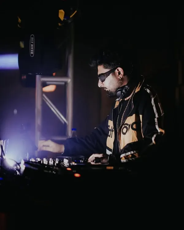 In the zone at Badmaash, surrounded by darkness and focused on the light of the console. This is where the magic happens.
