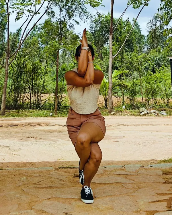 Eagle mode activated. Garudasana, or Eagle Pose, is a powerful standing balance that improves coordination and opens the shoulders and hips. Here I am finding my focus and strength among the trees.