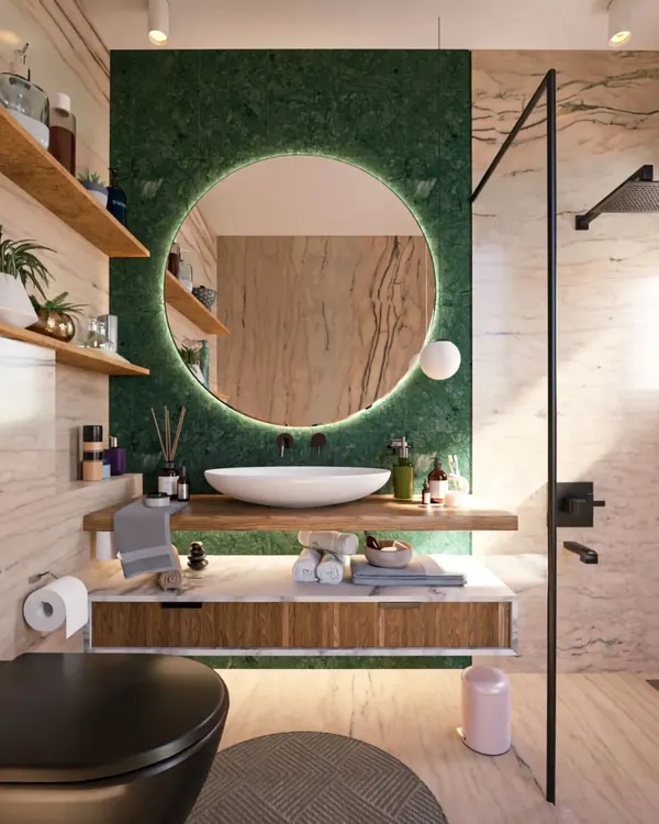 A luxurious bathroom render combining different materials for a rich, textured look. The green marble accent wall behind the backlit mirror contrasts beautifully with the lighter marble on the walls and the warm wood shelves.