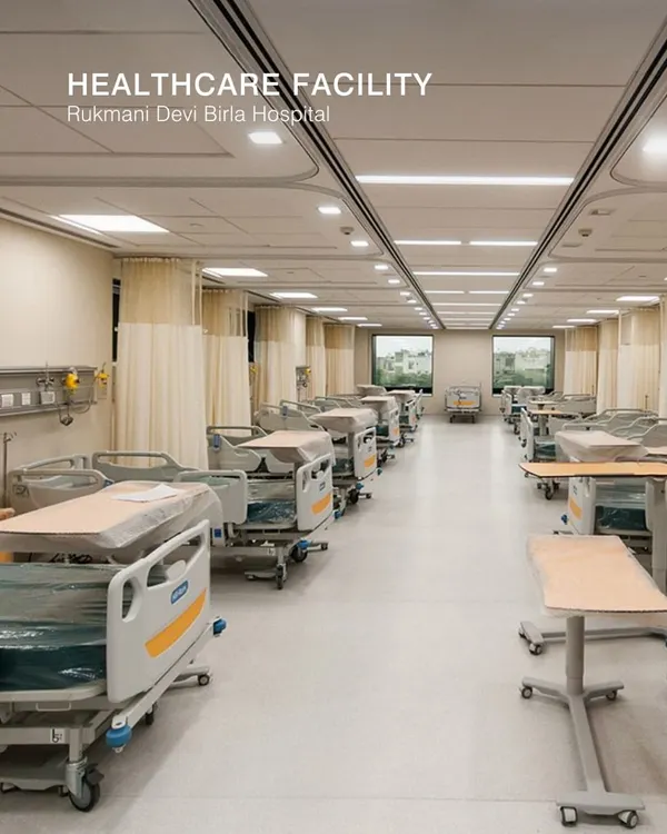 This is a ward at the Rukmani Devi Birla Hospital. The design prioritizes patient comfort and operational efficiency, with ample space between beds, clear circulation paths, and access to natural light from the windows.