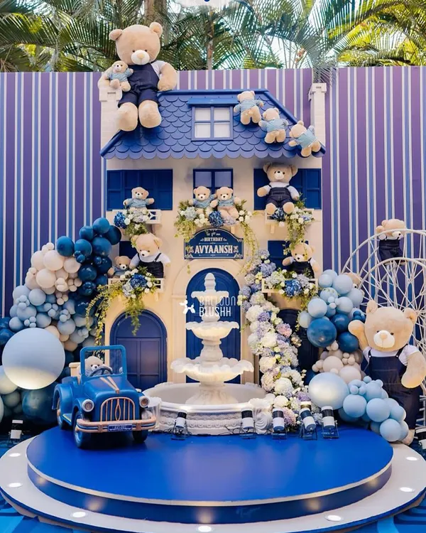 This grand teddy bear manor, complete with a fountain and vintage car, served as the breathtaking centerpiece for a first birthday celebration. Every detail, from the bears peeking out of windows to the cascading balloon garlands, was designed to create a world of cuddly elegance.