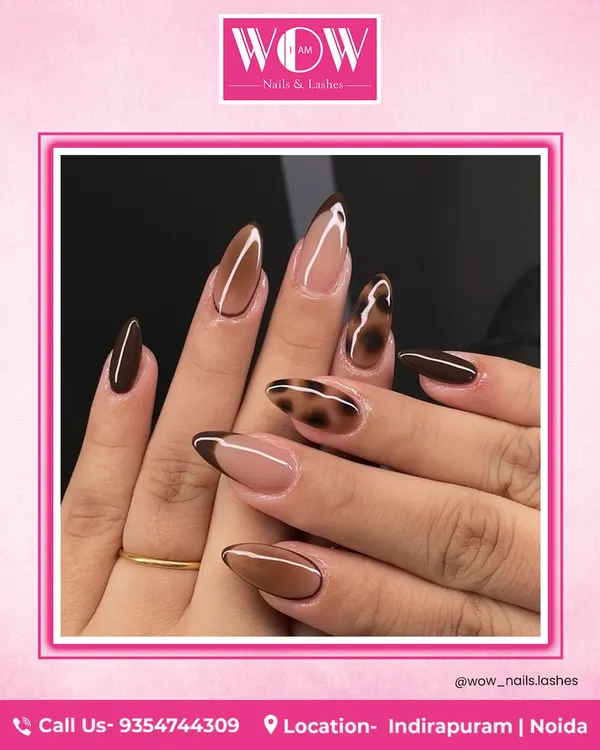 Unleash your wild side with this chic animal print design. Combining a rich brown with a classic leopard spot pattern and a modern French tip, this look is fierce and fashionable.