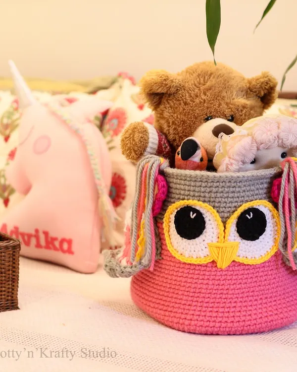 My bestseller, the Owlie Basket, shown here in a child's room filled with cuddly toys. The big eyes and colourful tassels make tidying up fun.