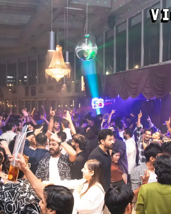 A packed house at Sarjapur Social for a high-energy Bollywood and Punjabi night. The crowd's energy, with hands in the air, is what I feed off all night long.