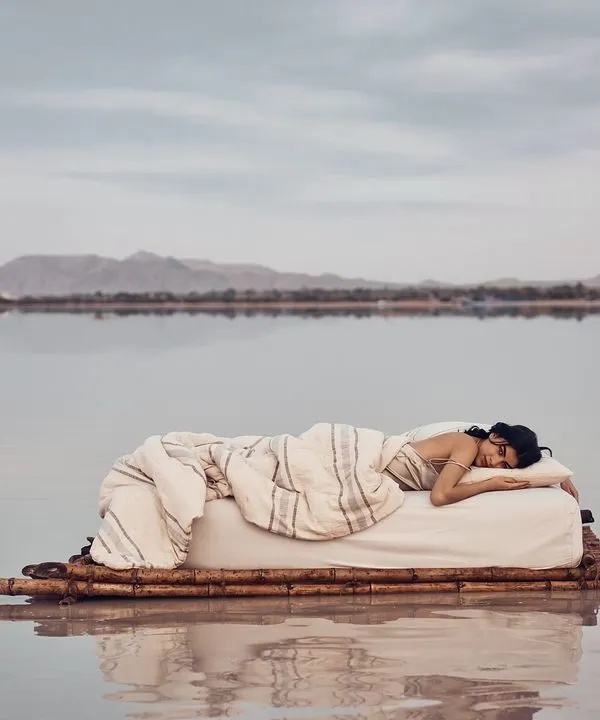 For this campaign, we created a dreamlike world to evoke a feeling of pure, uninterrupted peace. This shot, featuring a model on a floating bed, captures the surreal comfort of the product, blending lifestyle photography with high-concept art to create a truly memorable image.